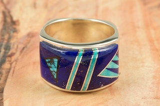 Genuine Blue Lapis and Sleeping Beauty Turquoise inlaid between ribbons of Sterling Silver.  Stunning Ring Designed by Navajo Artist Calvin Begay. Signed.